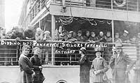 Photo # NH 103580:  Local residents bid farewell to men embarked on USS Powhatan, as she leaves Antwerp, Belgium in 1919